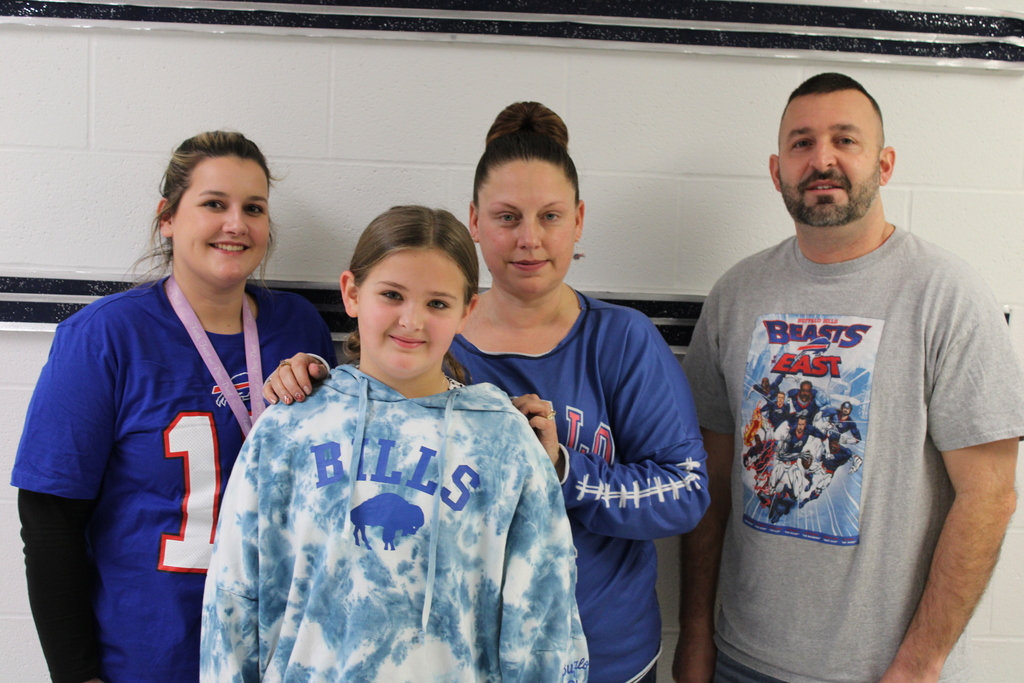 Afton student with teachers and Bills gear