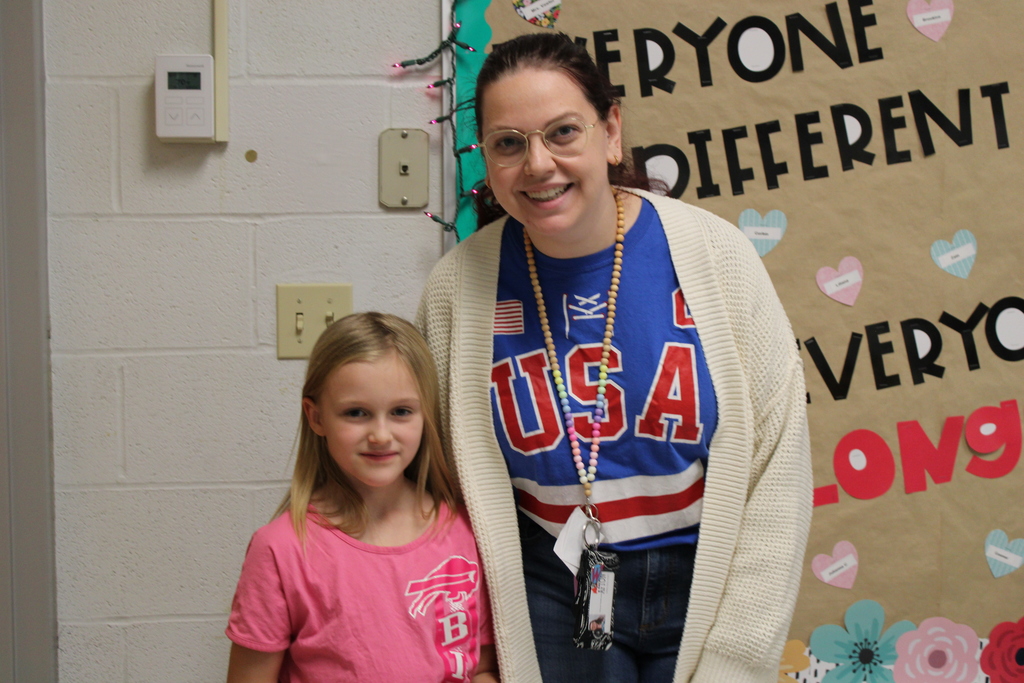 Afton Student with teacher and Bills Gear