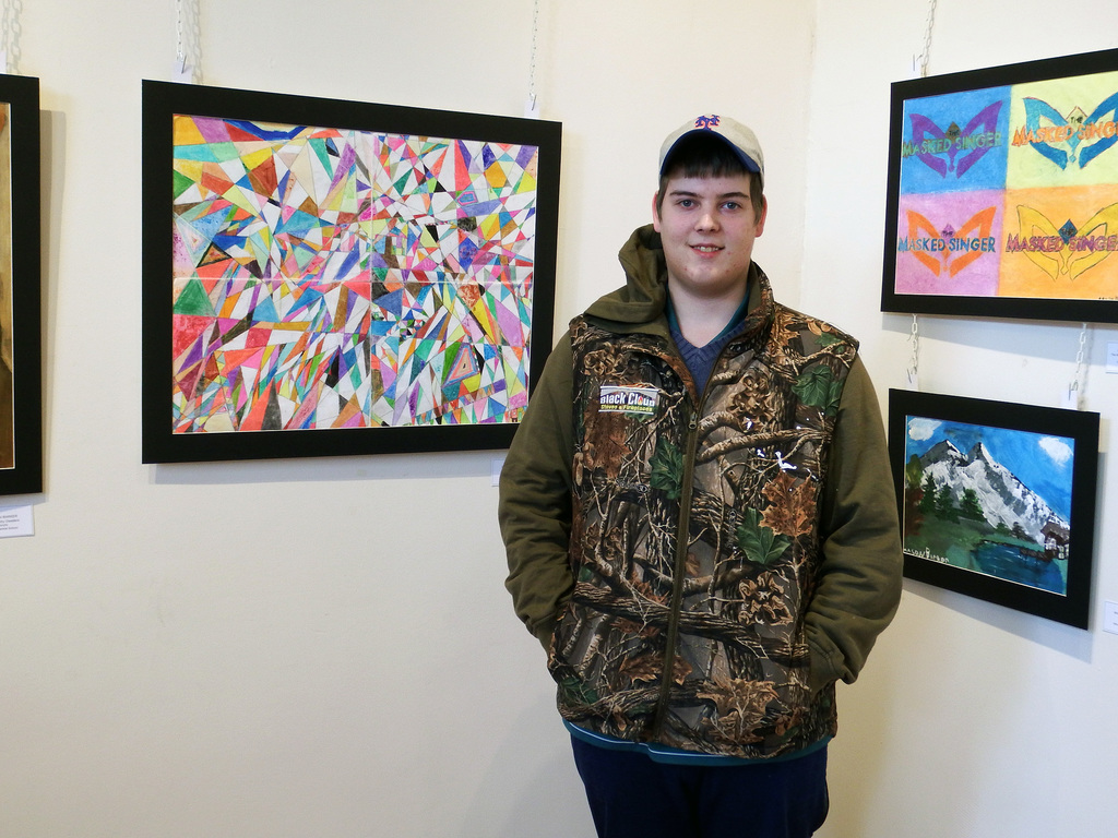 Mason Barker with his artwork